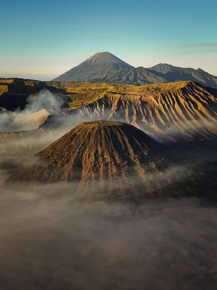 Stunning aerial shot of Mount Bromo and surrounding volcanoes at sunrise in East Java.